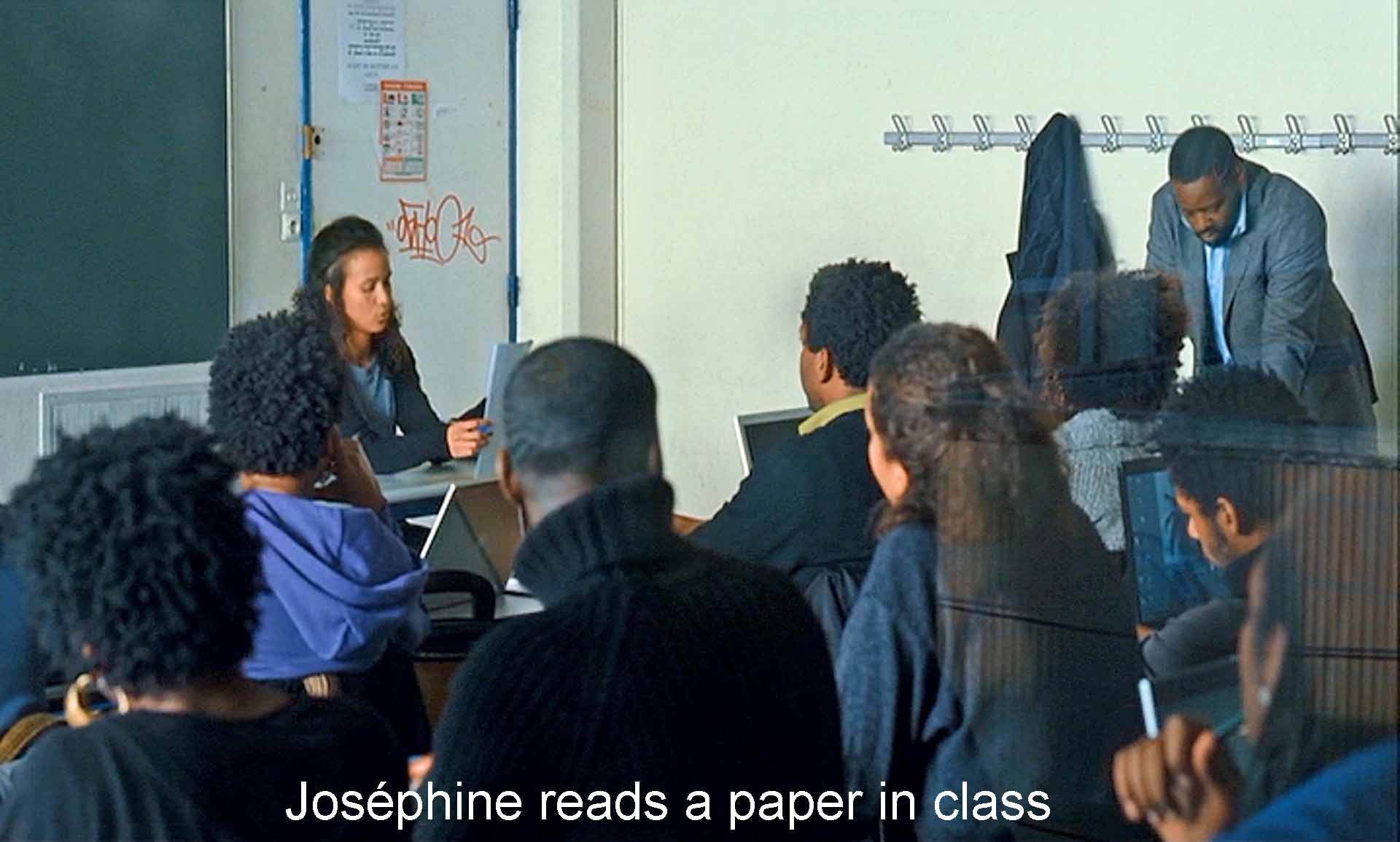 Joséphine reads a paper in class