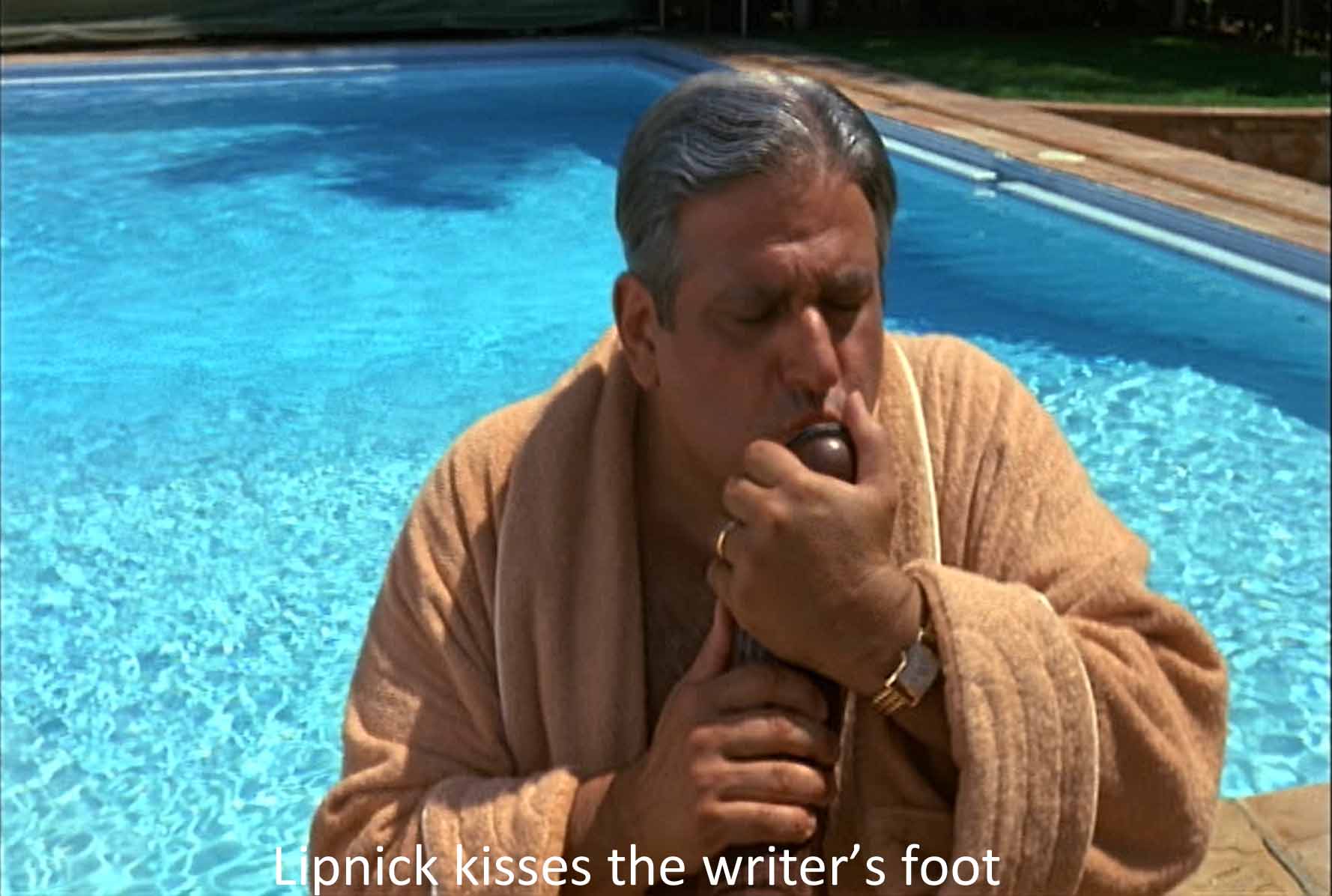 Lipnick kisses the writer's foot