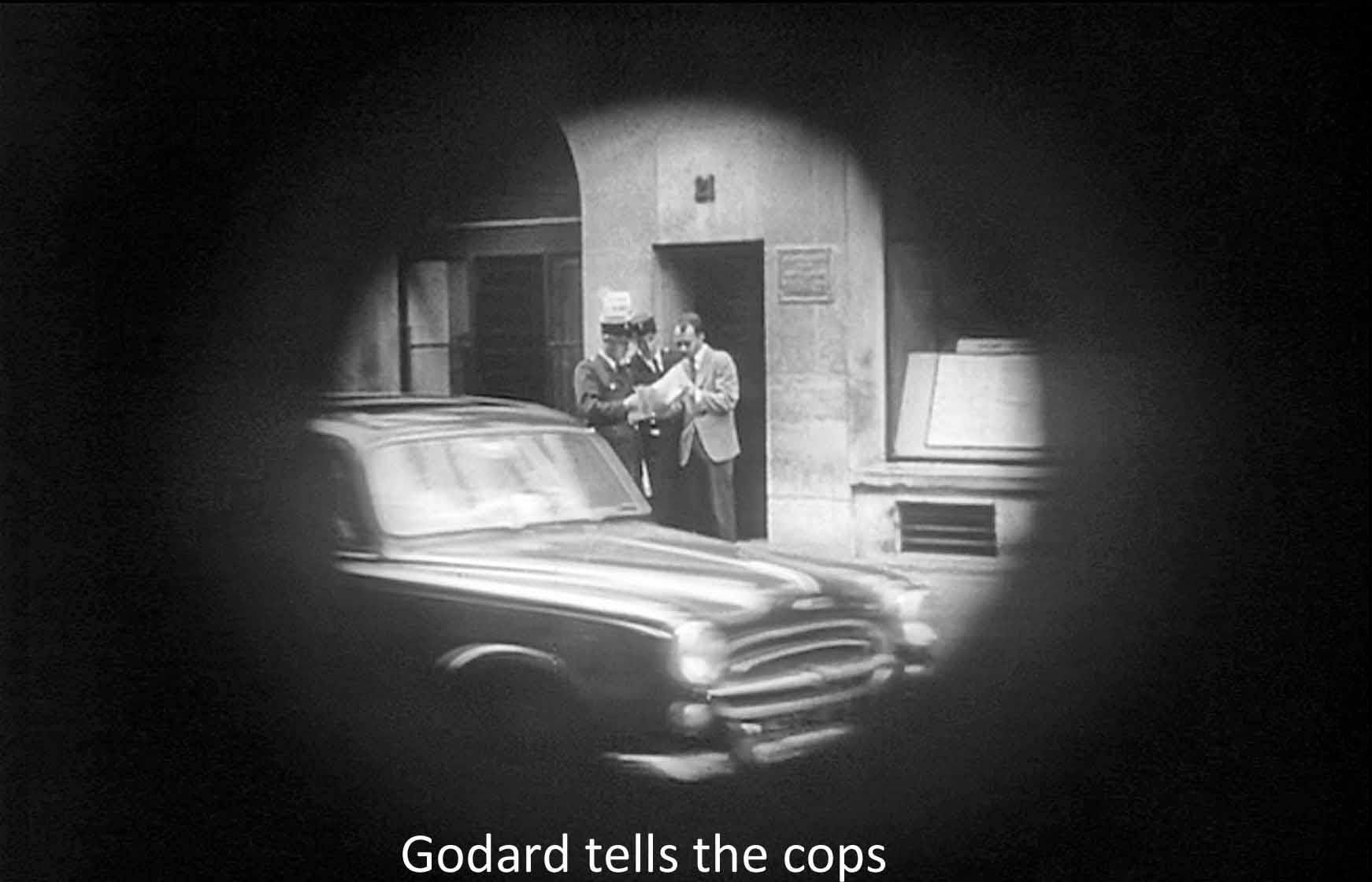 Godard tells the cops