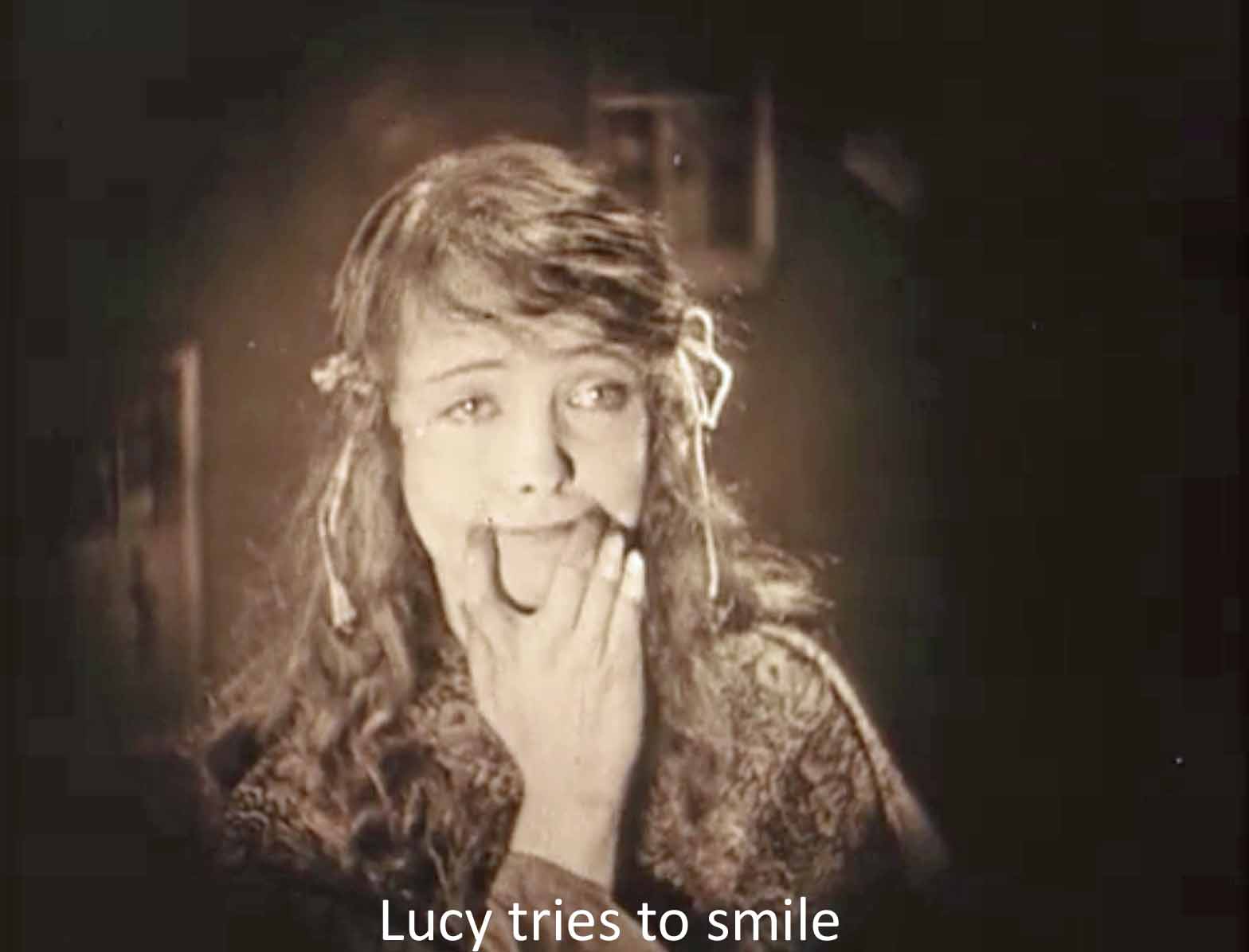 Lucy tries to smile