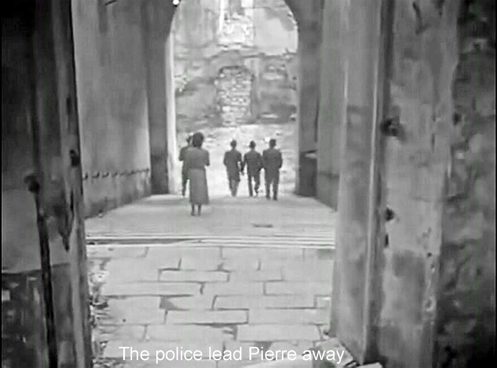 The police lead Pierre away