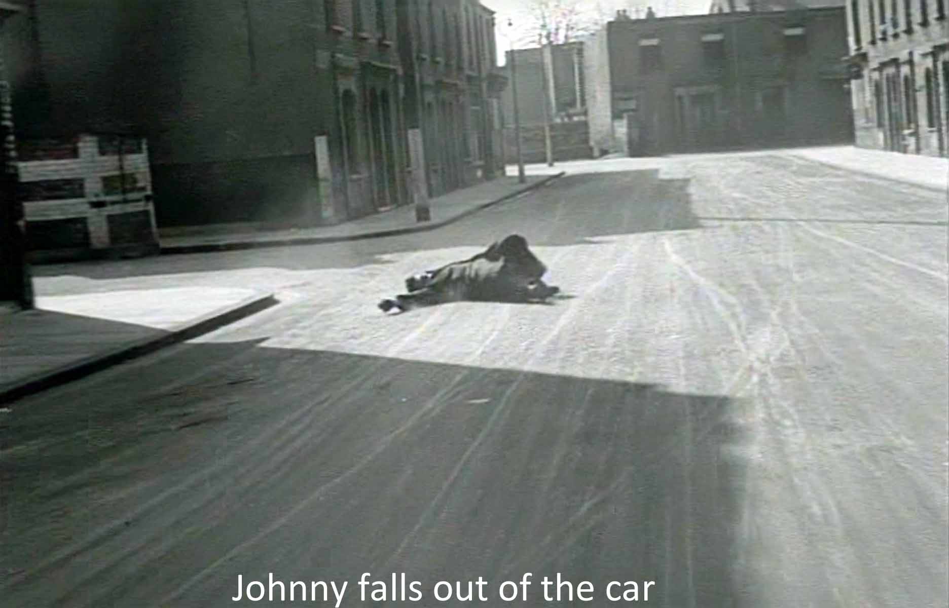 Johnny falls out of the car