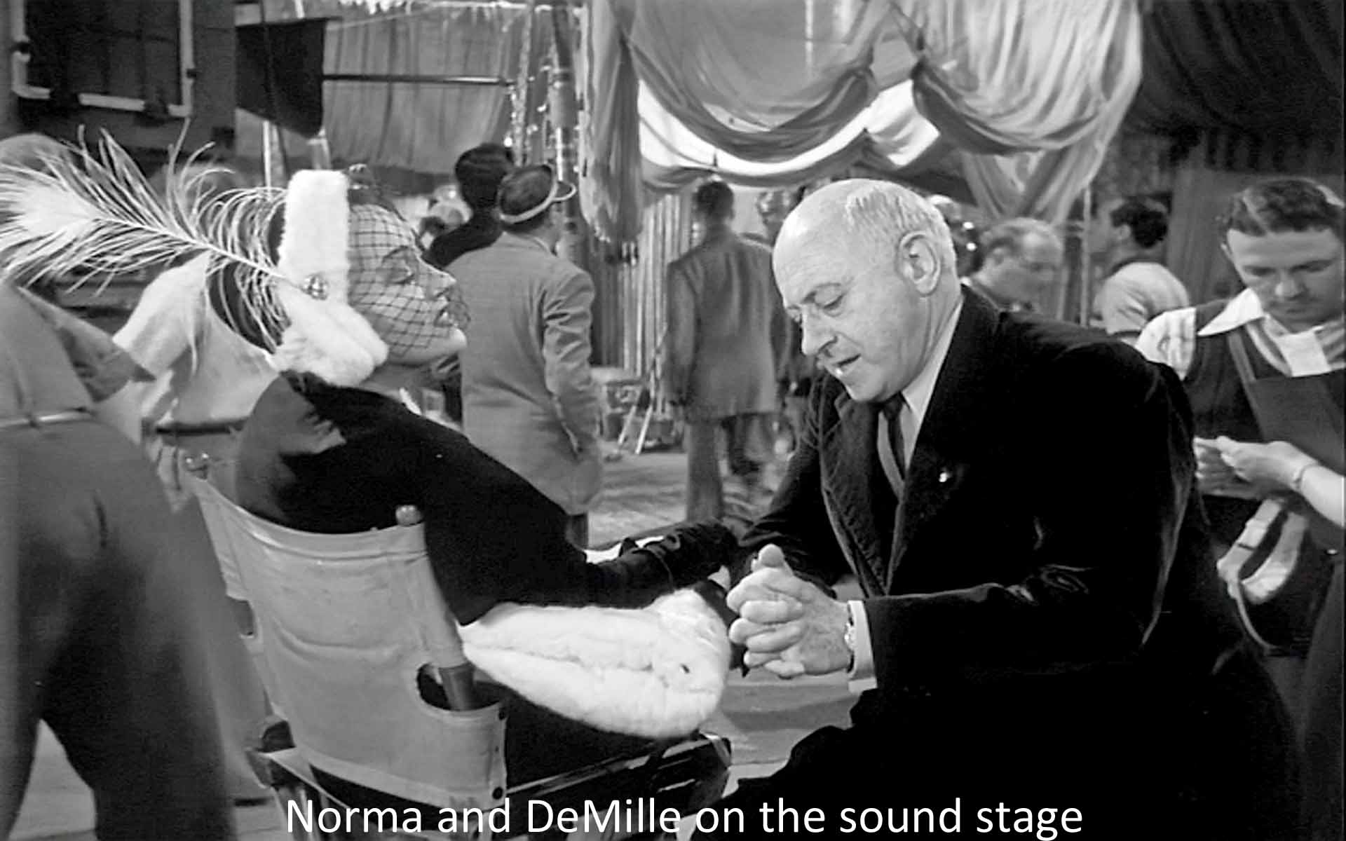 Norma and DeMille on the sound stage